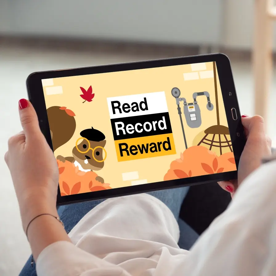 Person holding a tablet showing a cartoon with a squirrel and the words Read Record Reward on the screen.
