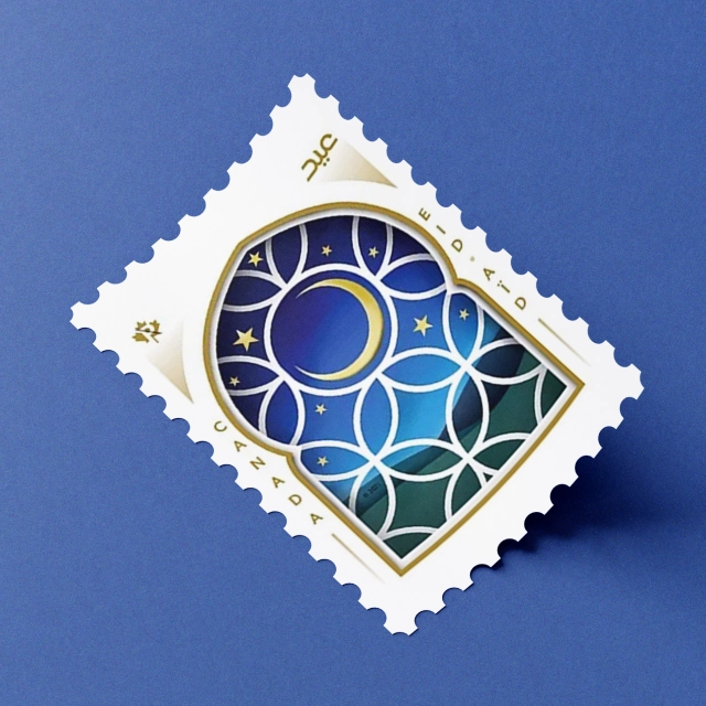 Canada Post “Eid” stamp featuring a crescent moon and stars in a stained-glass style geometric pattern, shown at an angle on a blue background.