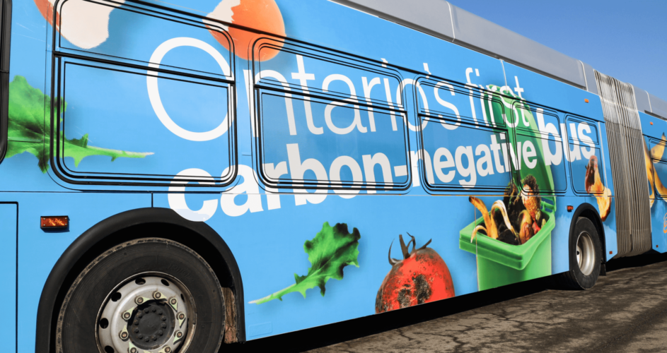 Close up of the side of Hamilton bus with blue and food scraps graphic wrap